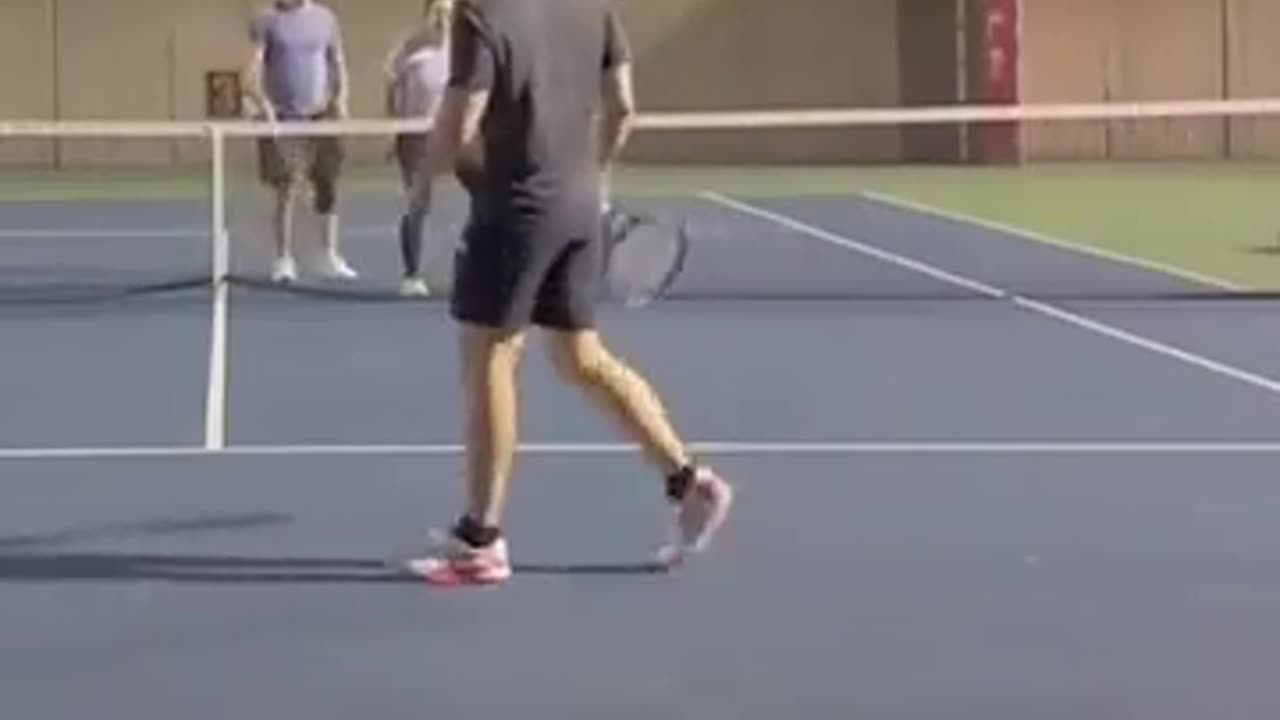 Woman looses it from being hit by a ball whilst playing tennis