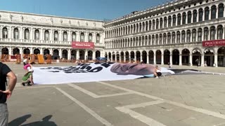 'Pay more tax': Huge banner targets Bezos ahead of Venice wedding