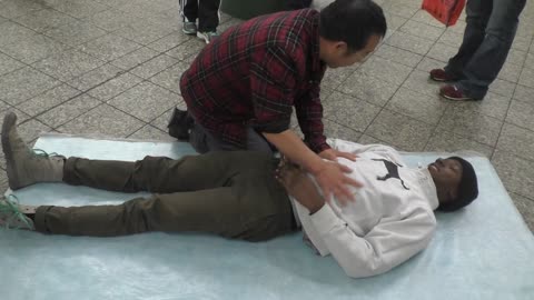 Luodong Massages Skinny Black Man In The Subway Station