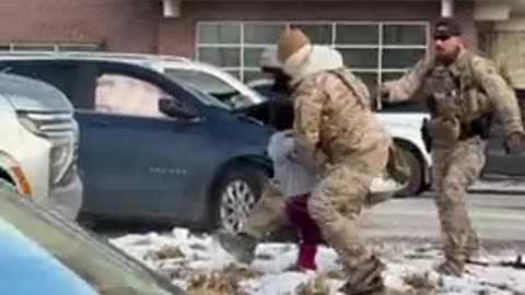 Female agitator rams her car into a federal agent's vehicle, then slams into a pole