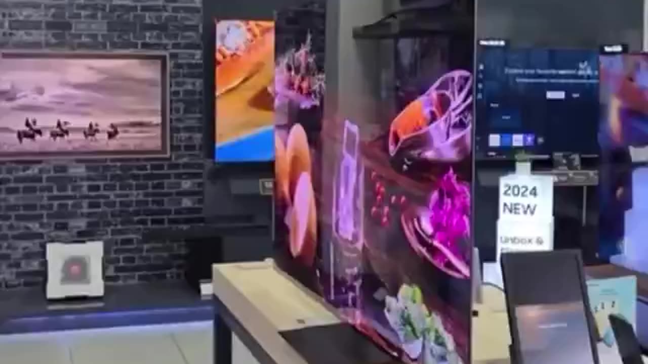 Samsung's ultra-thin OLED TV features a screen that is just 0.3 inches (0.7 cm) thick
