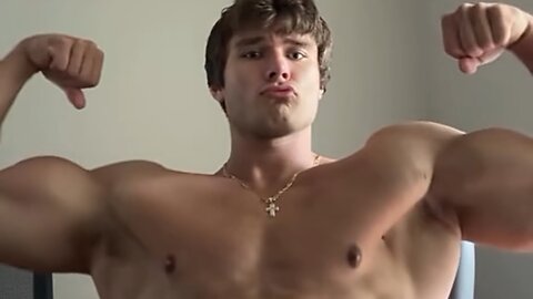 Handsome muscular man showing off his muscles