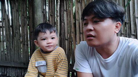 Grey And His Uncle Are Looking At The Chicken