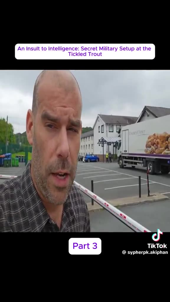 Charlie Veitch outside Tickled Trout migrant hotel telling security what he thinks about