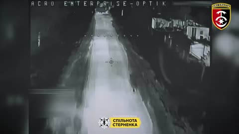 Ukrainian Drone Smashes into the Open Back Door of a Russian APC As Nearly a Dozen Run For Cover