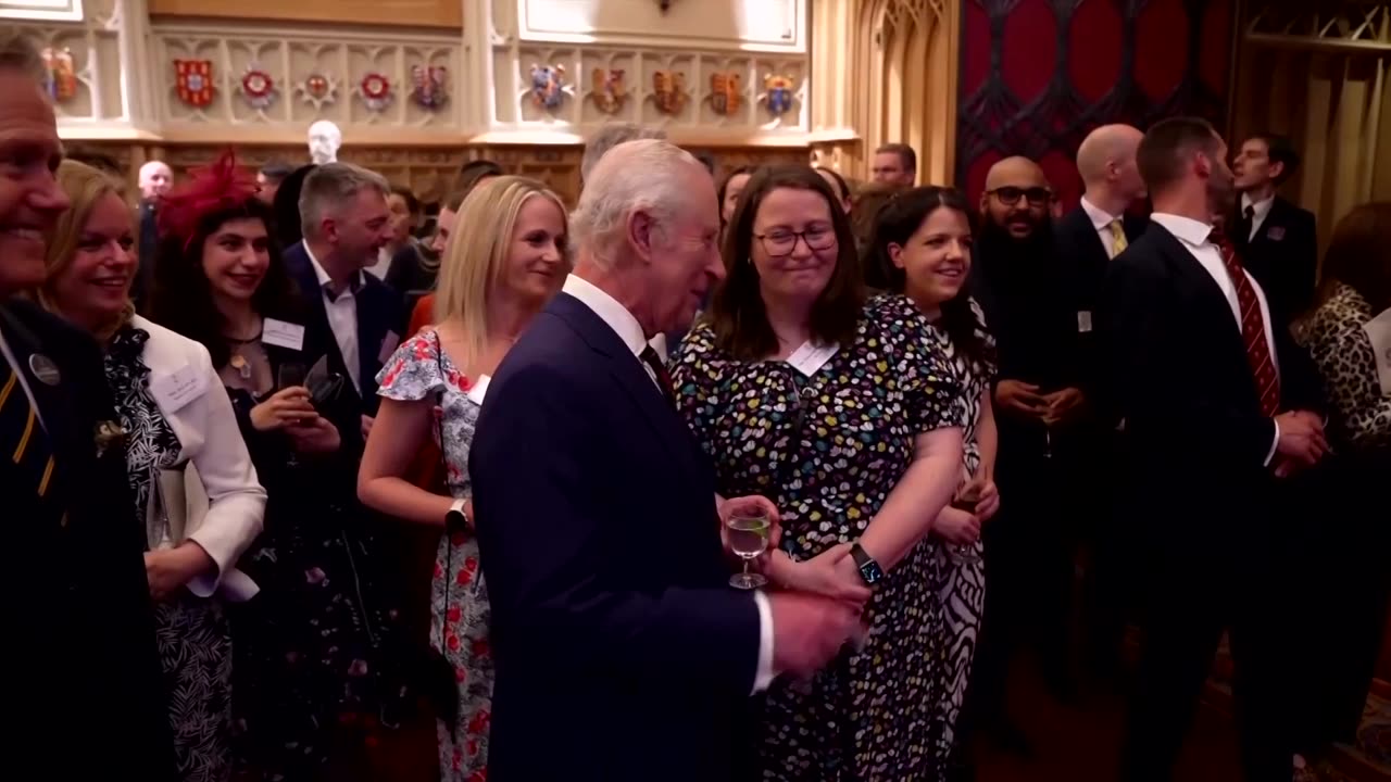 Britain's King Charles plays a song - on a carrot