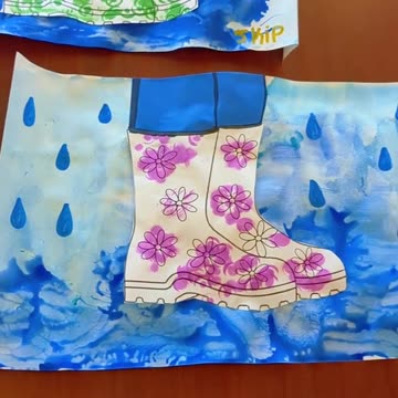 April Rain Boot Craft with our residents from Memory Care painting