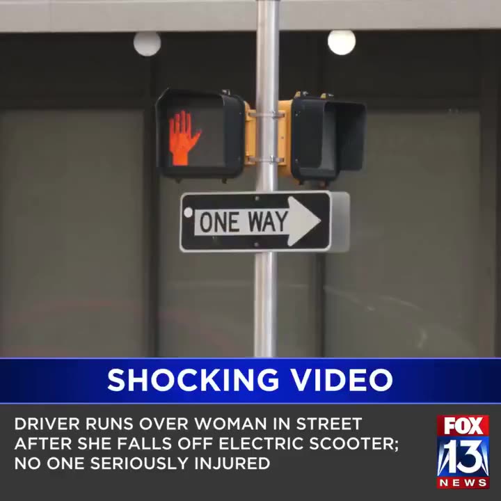 Shocking moment a woman falls off an electric scooter in the middle of the street…