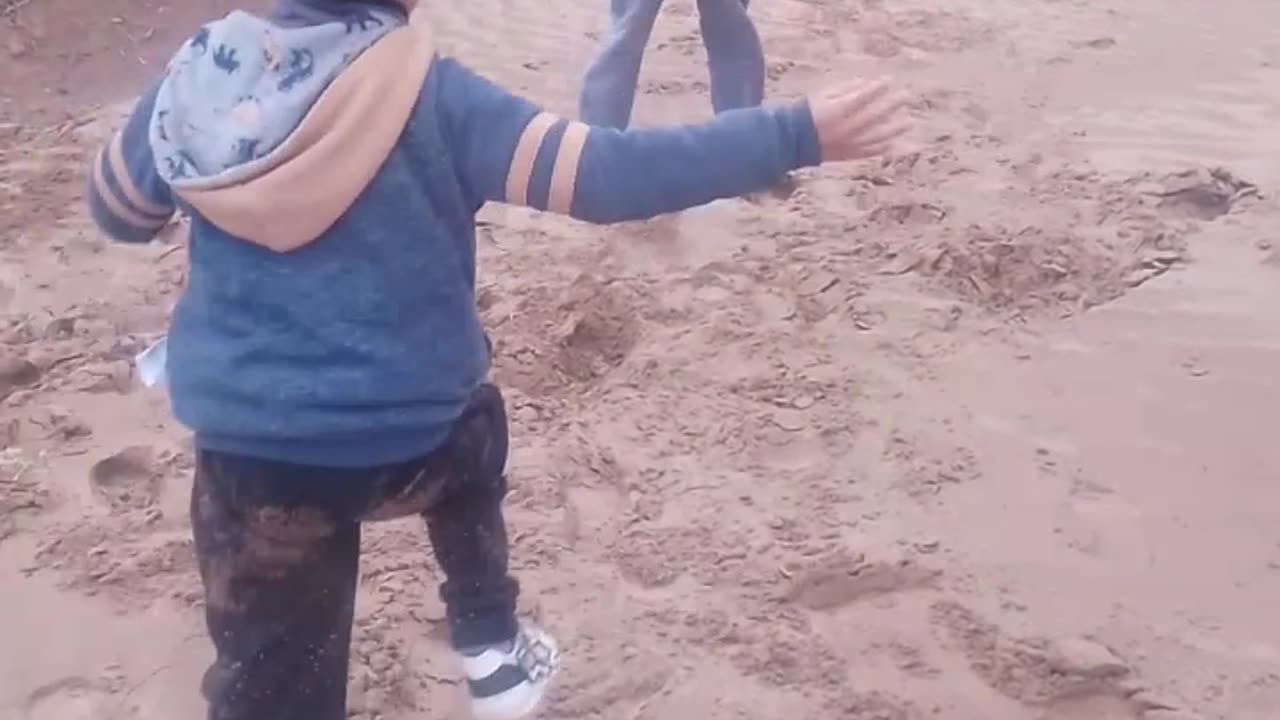 Two Kids Tumble Downhill