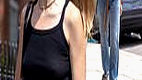 Braless Margot Robbie Steps Out Wearing Dark Sungl