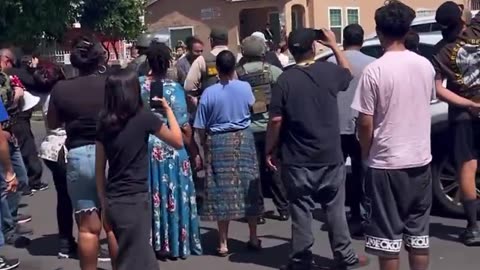 Los Angeles residents surround law enforcement and shout right in their faces.