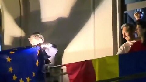 The "Winner" of the Romanian election waves the flag. Not the Romanian one, the flag he's loyal to