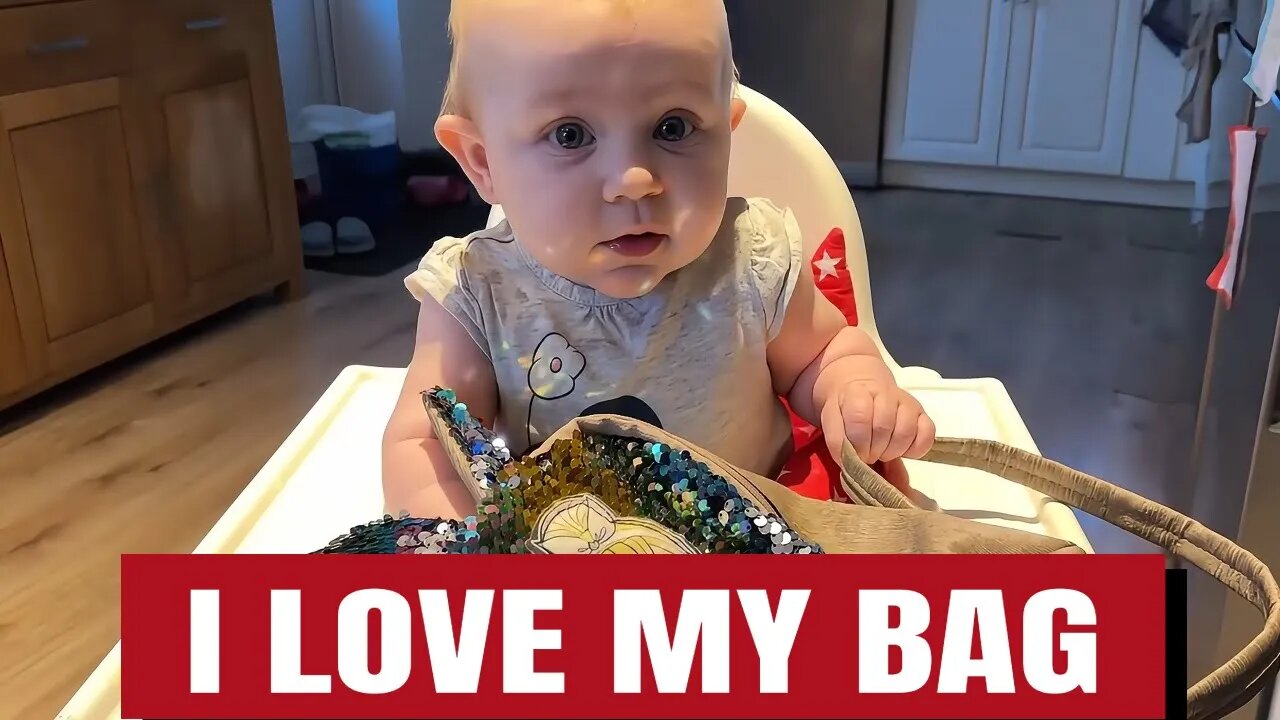 You Won't Believe This Baby's Reaction to a Shiny Purse!