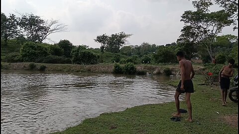 village boys enjoy in pond and they swimming