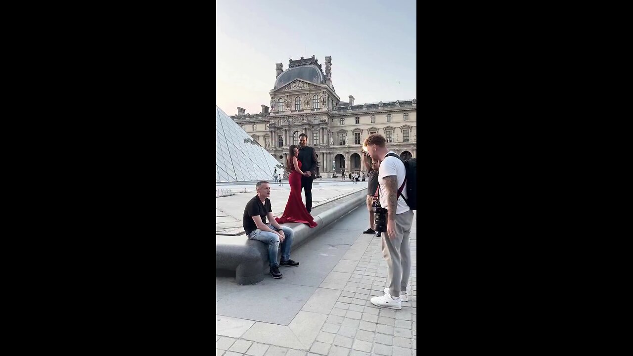 A bystander refused to leave the scene while professional photographs of a couple were being taken.