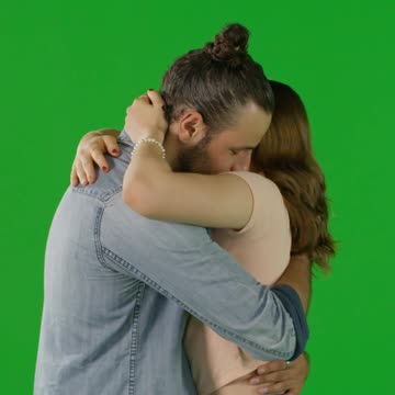 Young Couple Hugging on Green Screen