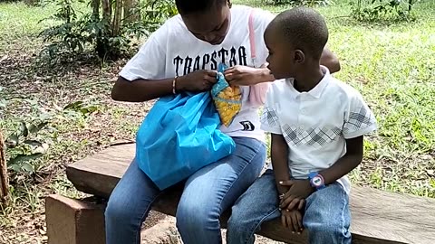 Monkey Snatches Chips From a Boy at a Park