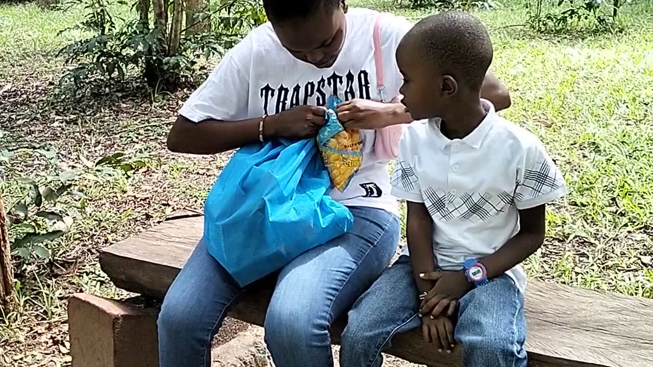 Monkey Snatches Chips From a Boy at a Park