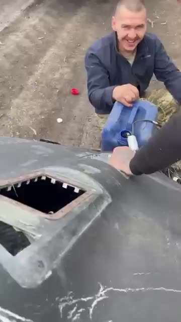 Ukrainian Farmers Drain Fuel from Crashed Russian Drone