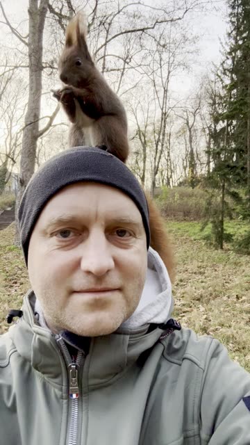 Squirrel Jumps Onto My Head to Eat a Nut