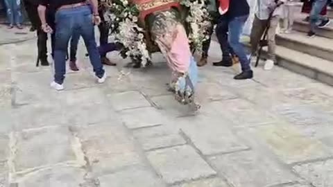Saint Falls During Procession