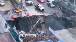 A huge chasm has engulfed a section of a bustling street in Bangkok.