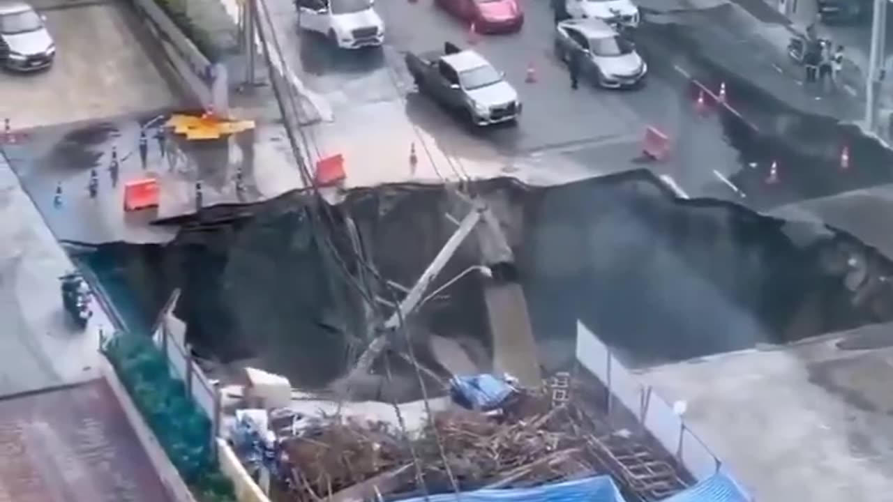 A huge chasm has engulfed a section of a bustling street in Bangkok.