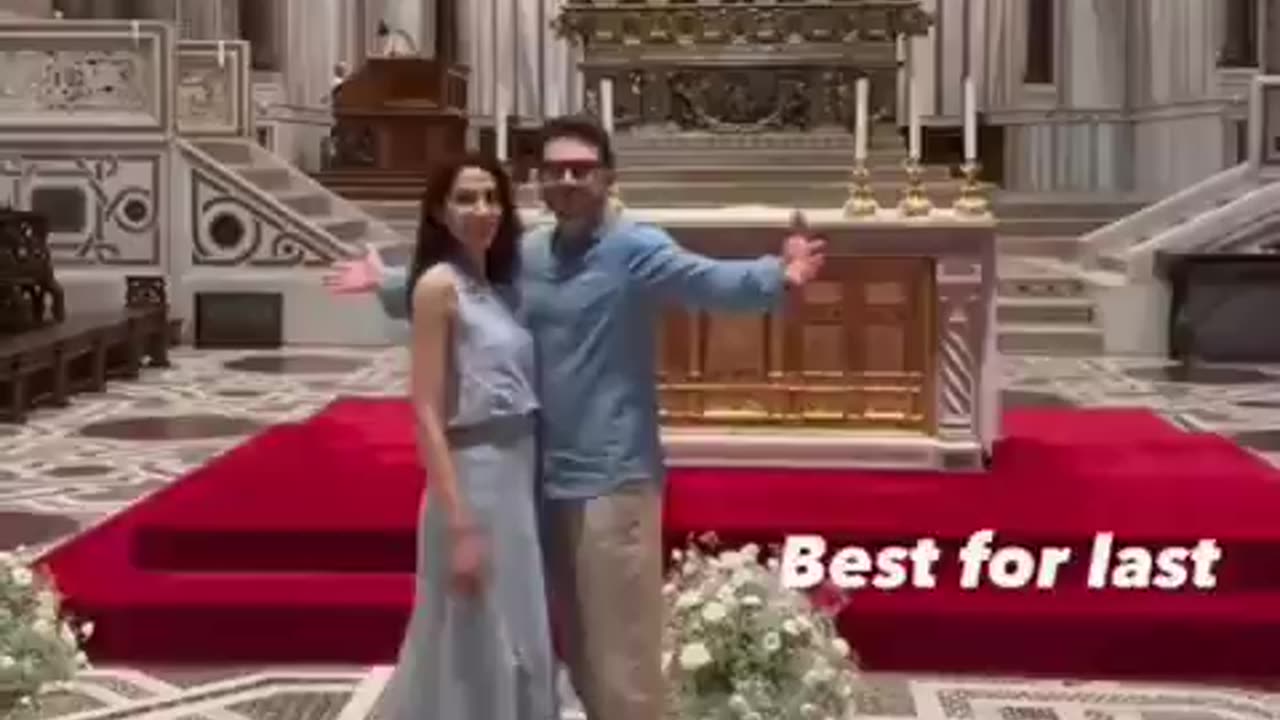 Alex Soros is seen mocking the crucifixion pose of Christ, arms out and head