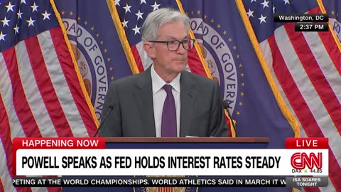 Fed holds interest rates steady despite pressure from Trump