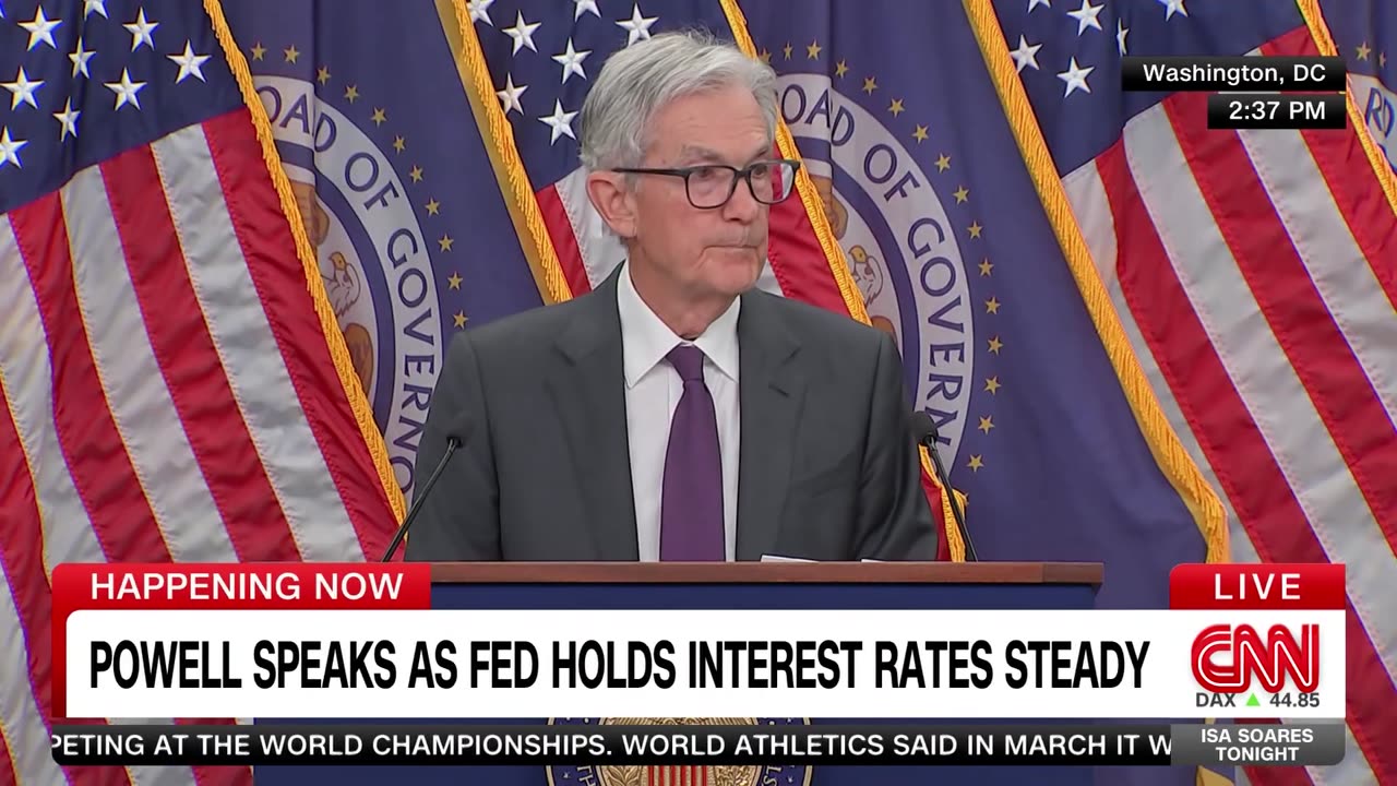 Fed holds interest rates steady despite pressure from Trump