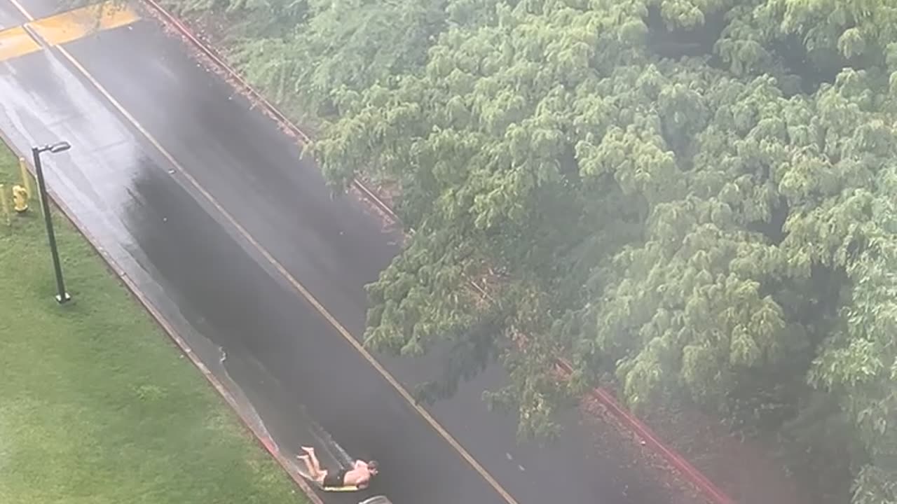 University Student Surfs Road Wave