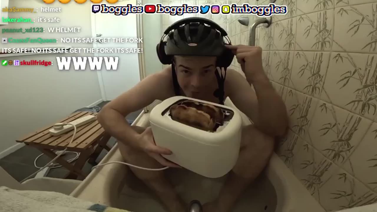 Streamer tests dropping a live toaster in the bath he's taking