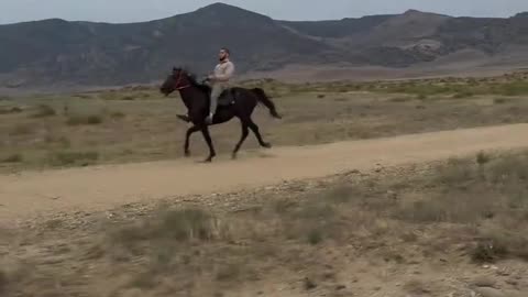 Islam Makhachev Riding a Horse