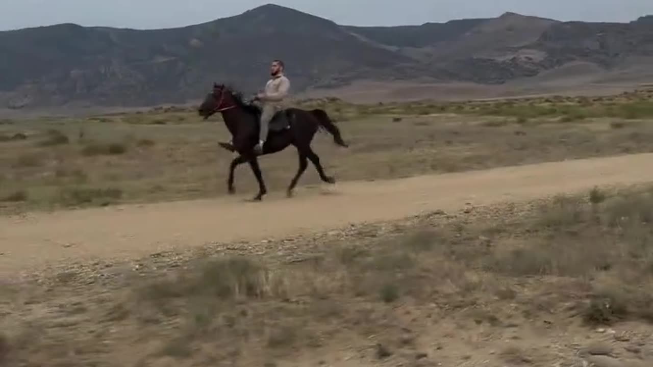 Islam Makhachev Riding a Horse