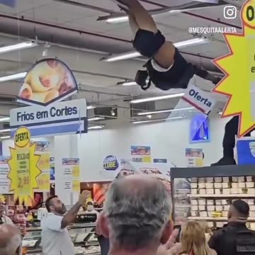 Brazil cop pulls down suspect down from rafters, crowd cheers