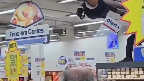 Brazil cop pulls down suspect down from rafters, crowd cheers