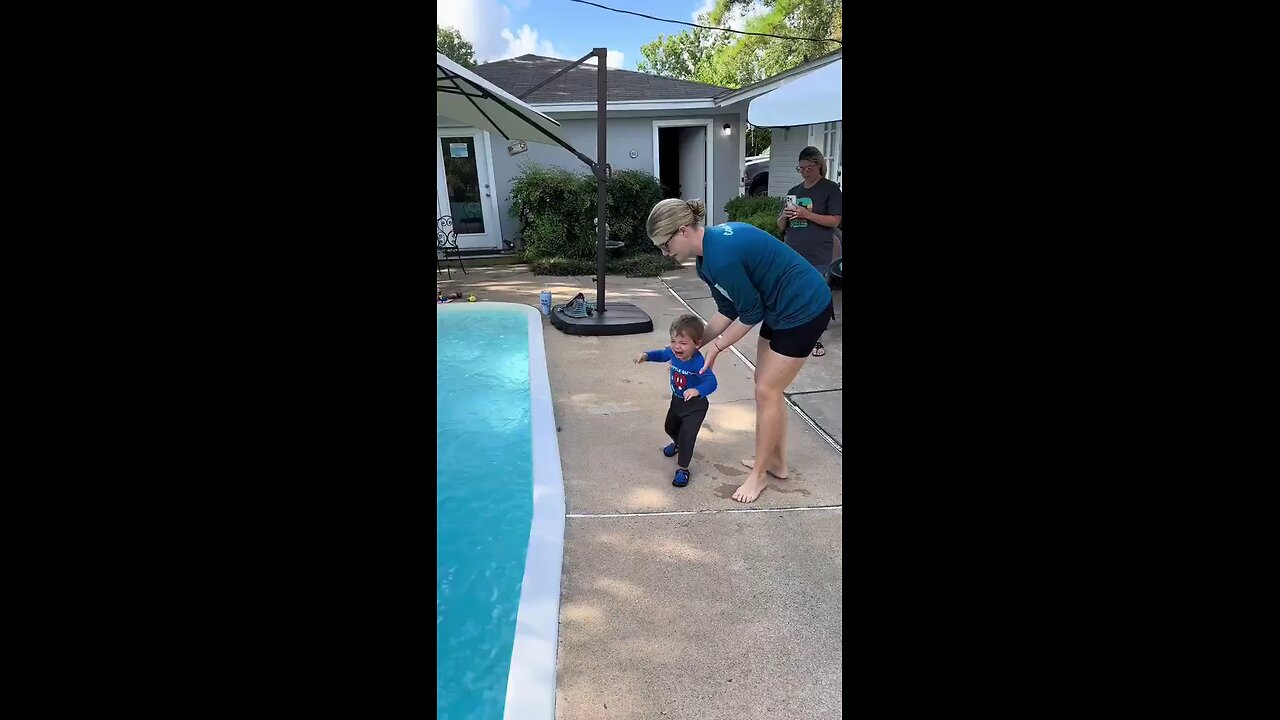 A woman faces intense backlash on social media after throwing her son into a pool