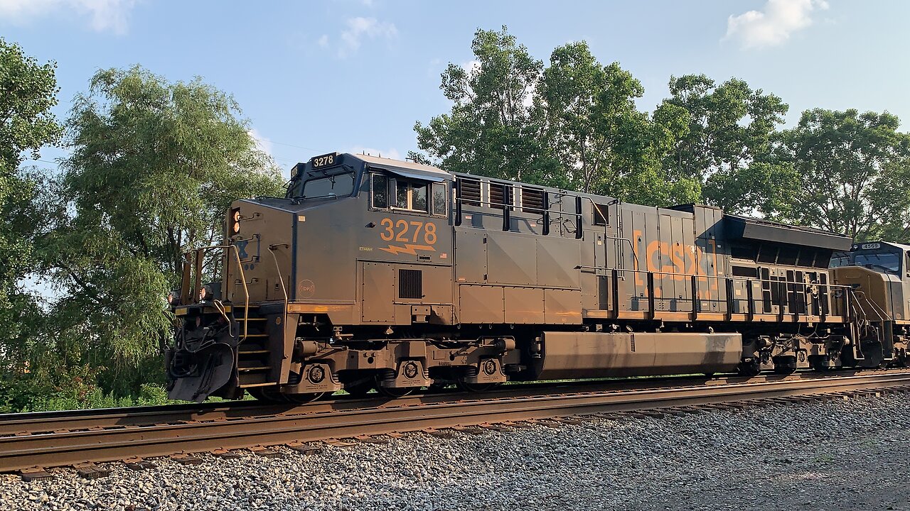 CSX Trains 3278 and SD70MAC 4569 speed by
