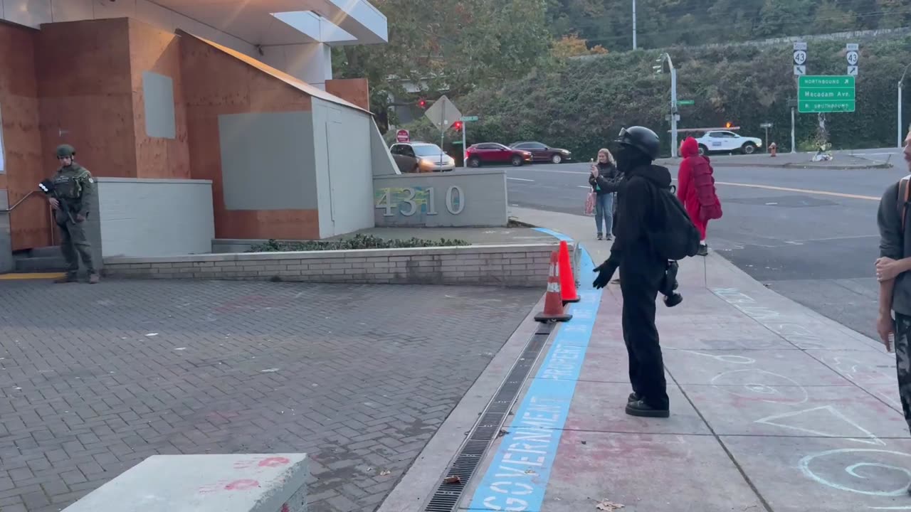 ICE Building, Portland, OR. A young woman in bloc spent several minutes screaming