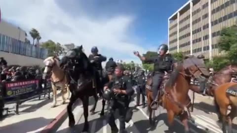 unlawful assembly declared in Los Angeles. System pigs are clearing the crowds
