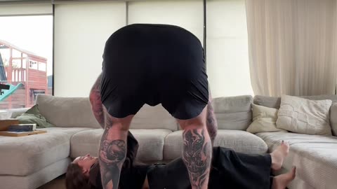 Couple Attempts To Lift Each Other Onto Couch