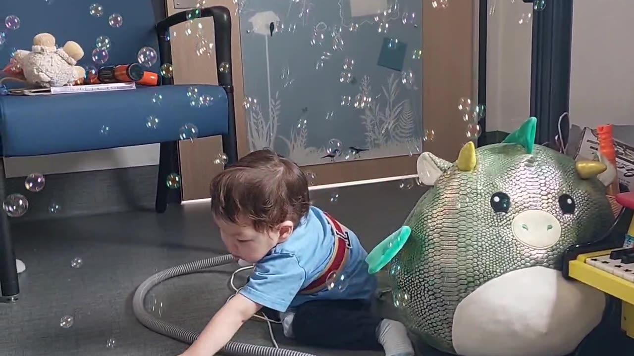 Theo playing with Bubbles