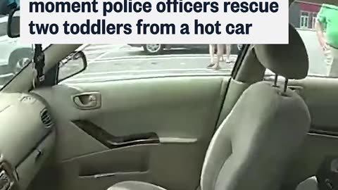 Bodycam footage shows the moment police officers rescue two toddlers from a hot car