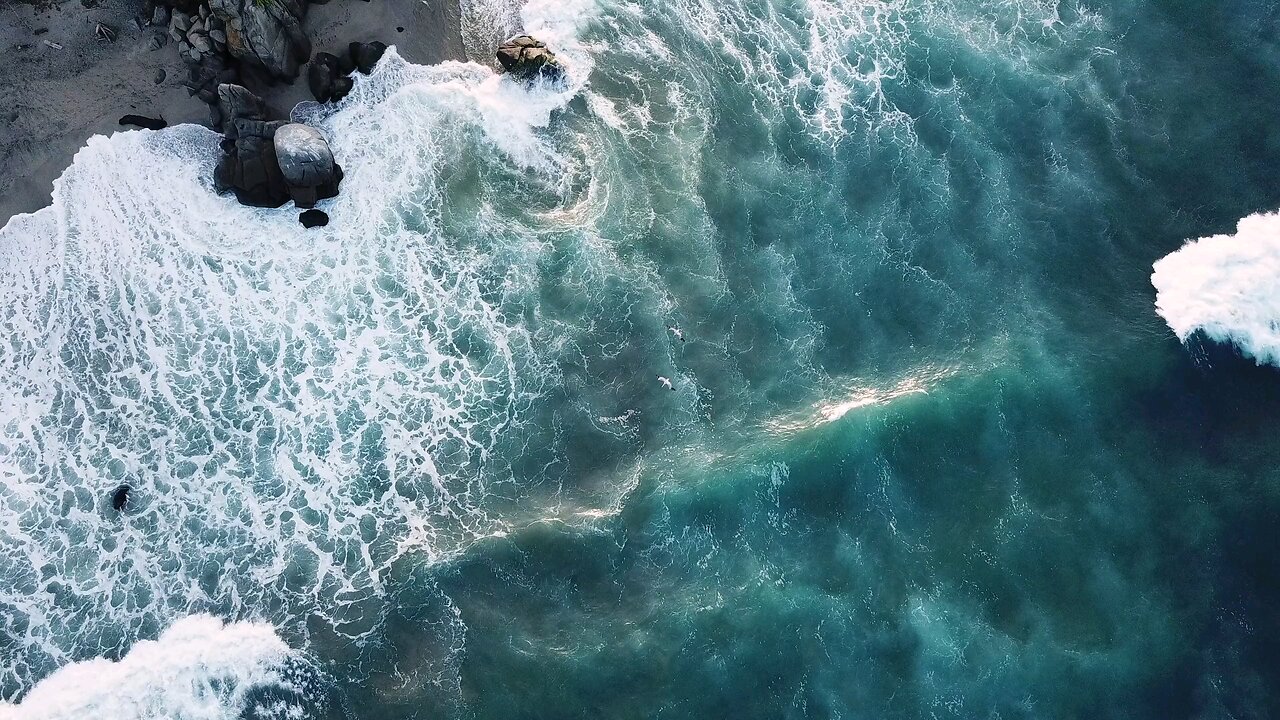Drone View Of Big Waves Rushing To The Shore