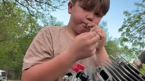 Koulie Kyle and Justus working on some smaller engines