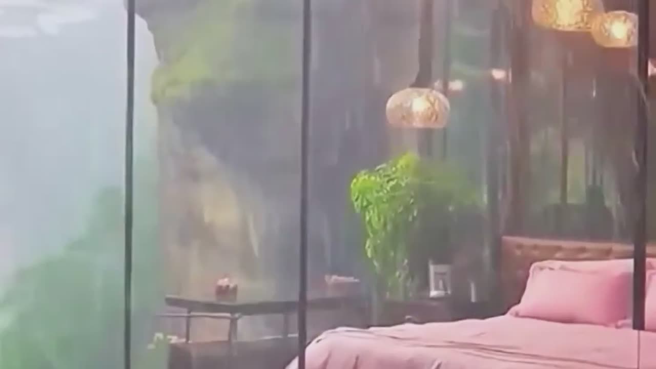 Cliffside Glass Resort Bedroom with Rainfall Views.