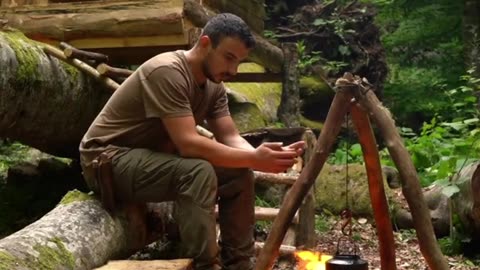 An Army Personnel make a small tree House all alone in wilderness