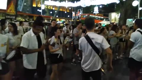 Students from SMU Samba Masala perform and dance in Orchard Road, Singapore