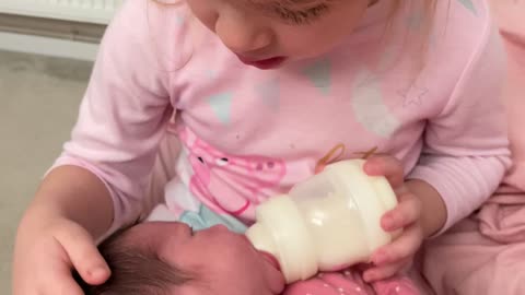 Blind Girl Feeling Her New Baby Sister
