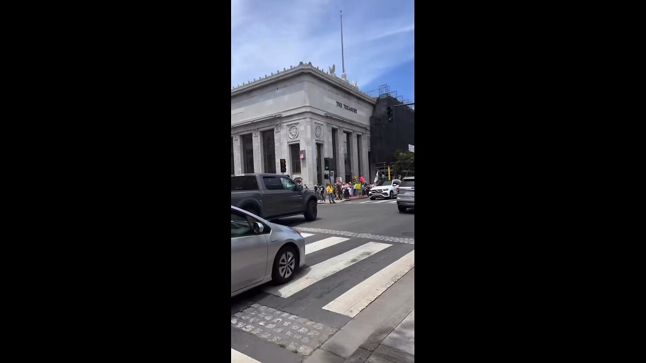 Driver with the green arrow in Petaluma, California, doesn’t stop for the ‘No Kings’ protesters.